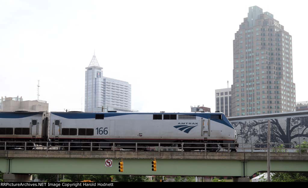 AMTK 166 leads the Silver Star away from the station